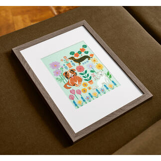 Kreuzstich Set mit einem bunten Hundemotiv in einem Rahmen.