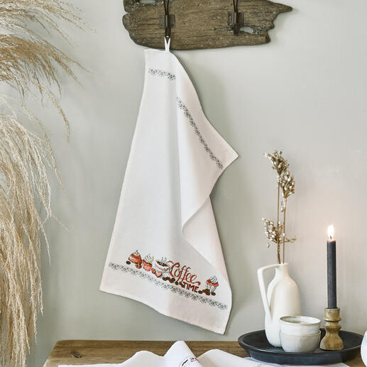 Geschirrtuch mit Kaffeetassen und Schriftzug 'Coffee Time' in warmen Farben.