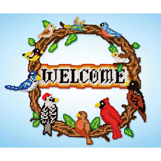 Bunt bestickter Vogelkranz mit dem Wort 'WELCOME'