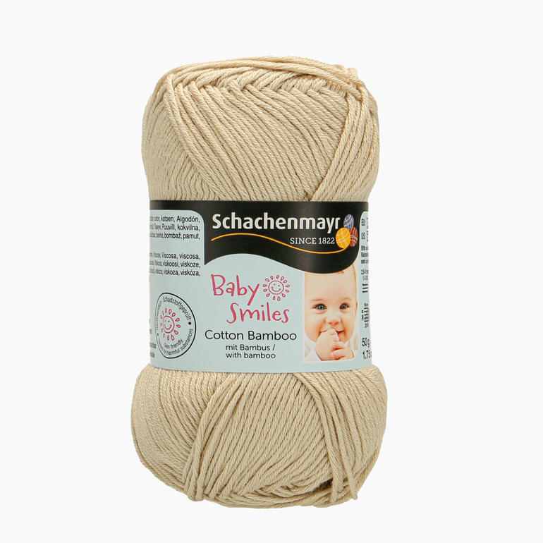 Wollknäuel in Sandfarbe mit Baby Smiles Cotton Bamboo Label.