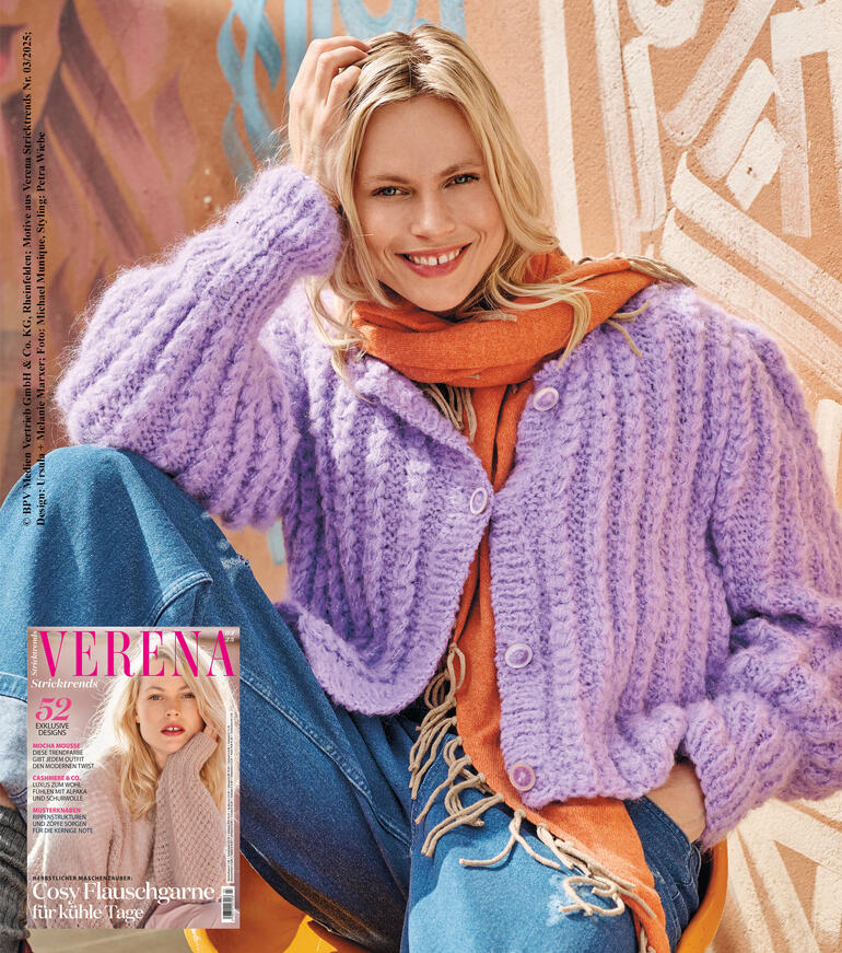 Jacke mit Puffärmeln aus Nappy in lila, abgebildet auf einem Modell mit Orange-Schal.