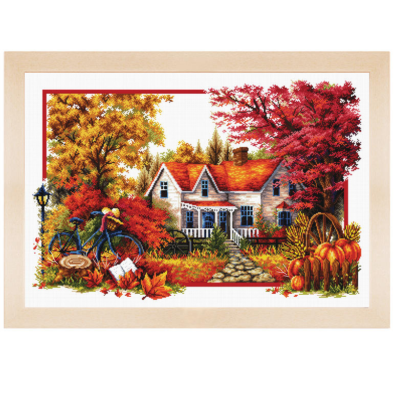 Stickbild mit herbstlicher Landschaft und Rad vor einem Haus.