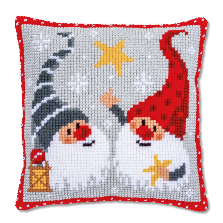 Kreuzstichkissen mit Wichteln und Sternen auf grauem Hintergrund