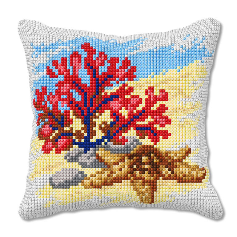 Kreuzstichkissen mit Unterwasserwelt und farbigen Korallen.