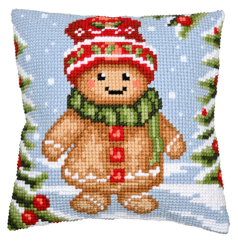 Kreuzstichkissen mit einem niedlichen Lebkuchenmann in einem Winterwald